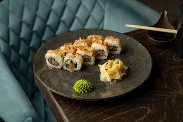 Delicate sushi rolls arranged artfully on a sleek plate, showcasing vibrant colors and textures, served with wasabi and ginger for a delightful culinary experience