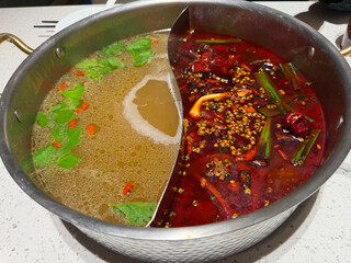 Yuan yang hot pot with spicy and clear broth