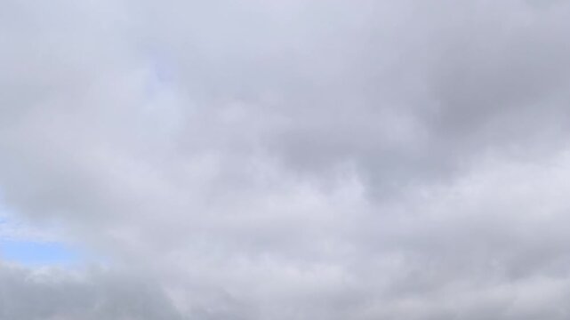 Sky completely covered by a turbulent gray cloud