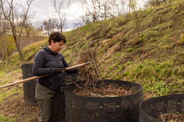Woman composting organic waste