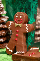 Christmas cookies, decorated with icing and chocolate gingerbread man in confectionery shop in London, UK