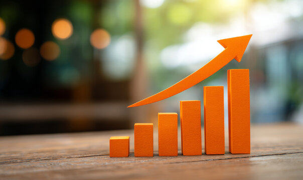 Orange 3d bar graph and arrow pointing animated movie on a wooden table, representing growth and success in business and finance
