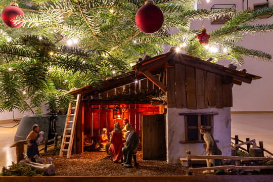 Close-up of nativity scene with kings and lamp