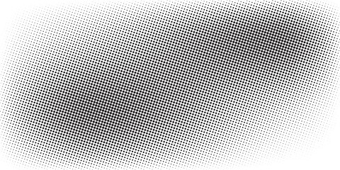 Fototapeta premium Abstract black halftone dots forming a smooth gradient pattern on a light background.