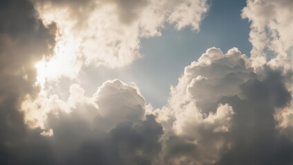 Obraz premium Dramatic Sunbeams Breaking Through Cumulus Clouds in a Blue Sky.