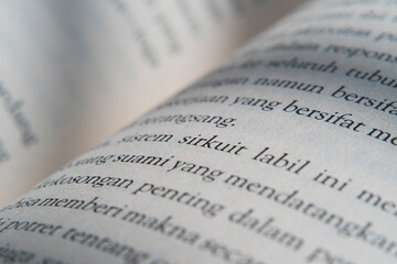 Fototapeta premium Macro Photography of Text on Book Page