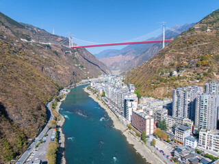 Xingkang Bridge Luding Yaye Expressway Bridge, Red Suspension Bridge Over a Valley Town