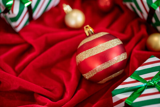 Merry Christmas. Happy Holidays greeting card,  banner. Christmas decoration  Red Christmas ornaments and gifts, presents on red background.  Xmas holiday festive theme.  