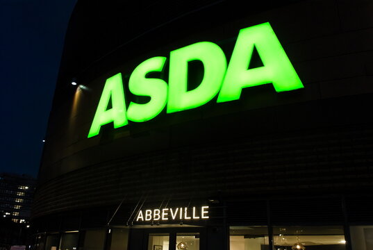 ASDA store logo at night on the Genoa Building, Short Blue Place. Barking, East London.  Dec 02, 2025