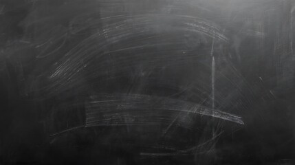 Empty classroom blackboard with subtle chalk residue and smudges, offering a rich, dark texture perfect for educational themes or grunge design projects