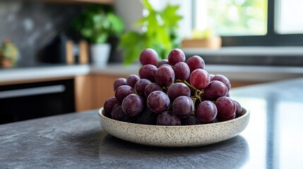 Grapes on plate on granite kitchen bar in modern apartment