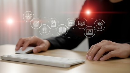Digital Learning Concept. Person Using Computer Mouse and Keyboard with Connected Technology Icons Overlay.