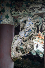 Obraz premium The exquisite wood carvings on the stage of Huaxi Tower in Bozhou City, Anhui Province, China. The Flower Theatre was first built in the Qing Dynasty.