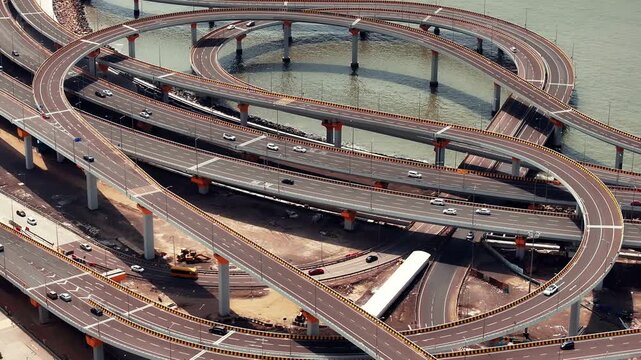 Morning view of the Mumbai Coastal Road in Maharashtra, India, famously known as the 'City of Dreams.' The scene captures a multileveled interchange roadway. A complex road network and urban design.