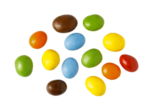 Colorful candy coated chocolates scattering on transparent background