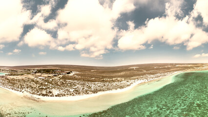 Aerial panoramic view of Coral Bay Western Australia showing turquoise waters and sandy beaches