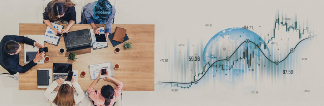 A diverse team works collaboratively around a modern desk, utilizing devices while reviewing financial data and market trends to drive business growth. Scalp - Powered by Adobe