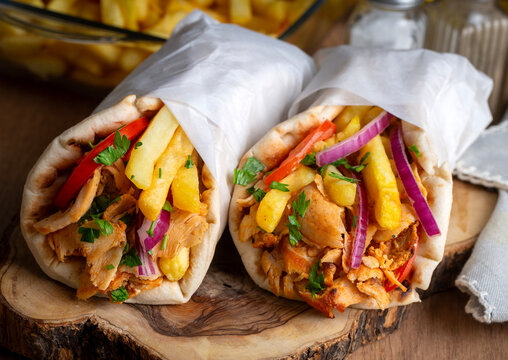 Greek chicken gyros wrapped in pita breads