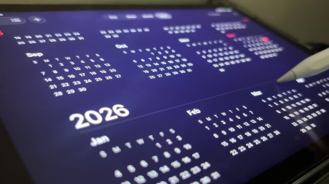 Scrolling down on the tab screen's device to see the calender from 2025 to 2026 to make  a new plan for the new year