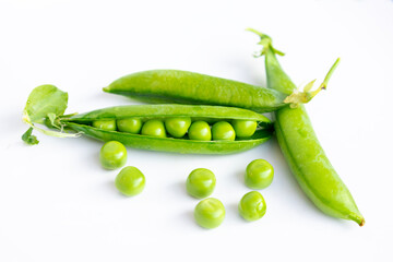 Fresh green peas in open pods on a clean white background, perfect for food packaging, healthy diet visuals, recipe blogs, agricultural ads, and nutrition content, showcasing organic produce..