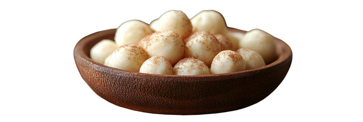 Light colored food items in a bowl close up