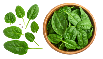 Fresh, vibrant spinach leaves, some isolated, others in a wooden bowl on a dark background