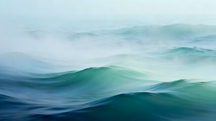 Abstract ocean waves with misty atmosphere and blue green color palette creating calming scenery view