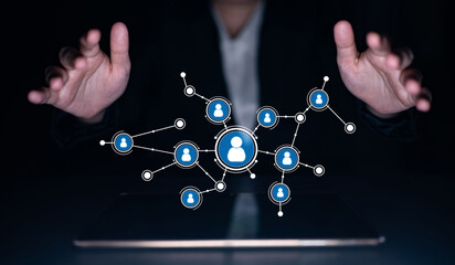 A conceptual image depicting hands reaching towards a digital network illustrating social media connections, highlighting modern business interactions in a tech-savvy environment. Tessel