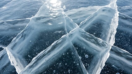 Mesmerizing texture of transparent blue ice with intricate cracks, reflecting brilliant winter sunlight on a pristine frozen surface