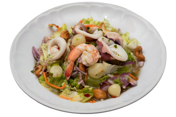 Thai-style spicy seafood salad served on a white plate, isolated on transparent background.