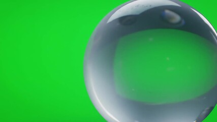Clear Glass Orb Floating Against Green Screen Background. - Powered by Adobe