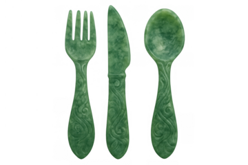 Jade cutlery set with ornate carvings including a fork, knife, and spoon, dining elegance, transparent background