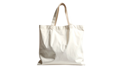 Plain white canvas tote bag with off-white handles, isolated on a solid black background