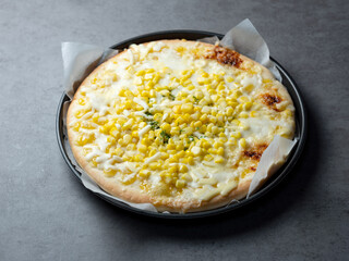 Cheese pizza with corn on the cob