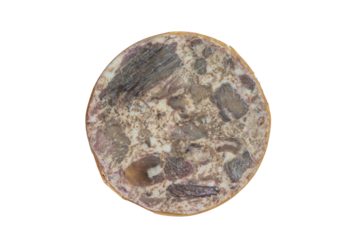 Turkish kavurma loaf with compressed browned meat fibers and rendered fat matrix, forming a dense traditional preserved meat block.