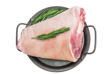 Uncooked pork hock displayed on cookware with fresh rosemary ideal for recipe illustrations food preparation themes and kitchen photography.