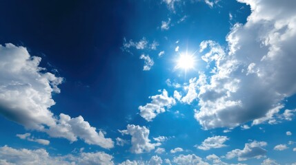 The sky is blue with a few clouds scattered throughout. The sun is shining brightly, making the day warm and inviting