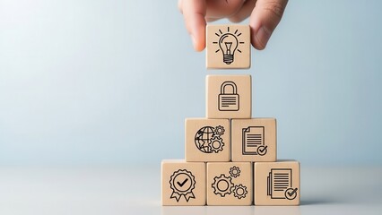 Hand placing idea lightbulb block on business process pyramid