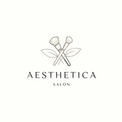 Aesthetica Salon Logo with Crossed Makeup Brushes and Leaves.