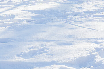 Winter snow. Snow texture. Play of light and shadow. Snow-white texture for design. Snowflakes