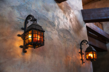 Vintage lamp light up attached on castle wall