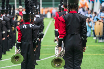 Rear of Student brass band prepare to preform musical in school