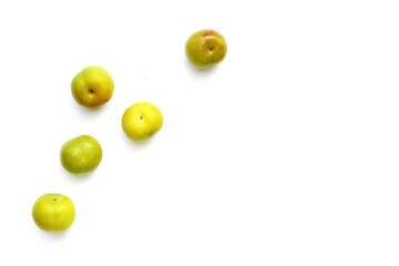 Fresh green plum fruit on white background.