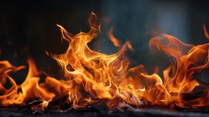 Fototapeta premium A large, bright orange flame with a dark background. The flame is surrounded by ash and debris, giving it a sense of destruction and chaos. The contrast between the bright orange flame