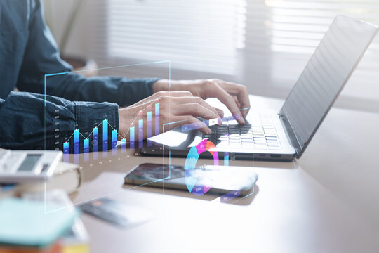 Hands typing on a laptop with digital charts, bar graphs, and analytic overlays, representing data analysis, business insights, and performance monitoring in a modern digital workspace. Analysis - Powered by Adobe