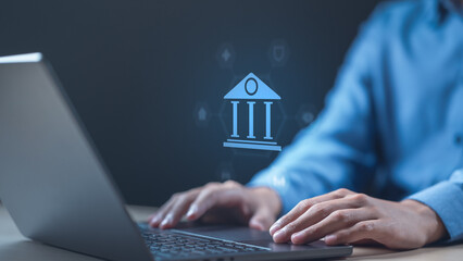 A person using a laptop with a digital banking icon displayed, representing modern financial technology, secure online transactions, and efficient digital finance solutions. Digital finance payment.