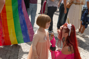 white girl meets unicorn under rainbow. vibrant pride parade scene with rainbow flag backdrop, joyful crowd,