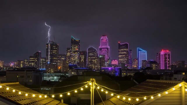 Neon Cityscape at Night with String Lights Rooftop View Modern Urban Skyline Illuminated