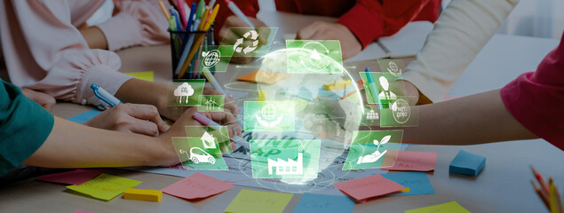 A vibrant workspace showcases diverse hands engaged in creative collaboration, generating ideas for sustainability with digital eco-friendly symbols, emphasizing teamwork and innovation. Trope