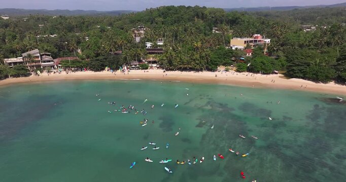 Aerial View of Hiriketiya Bay with surfers, Sri Lanka